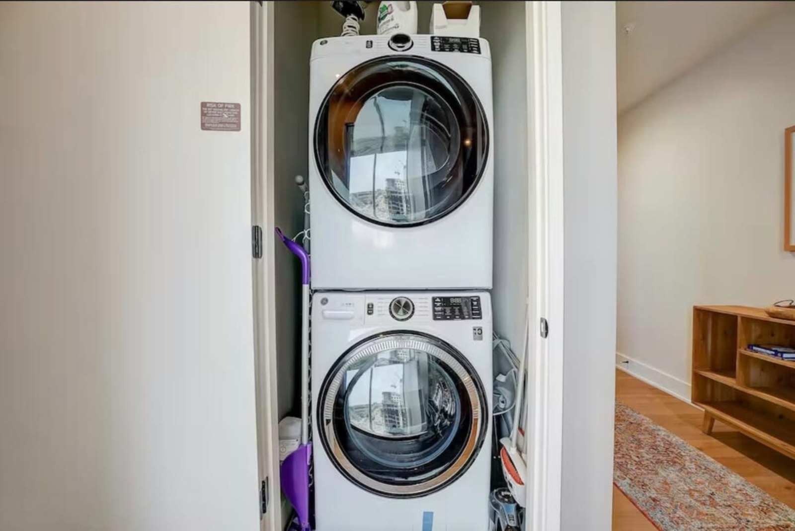 Stacked washer and dryer inside unit 1504