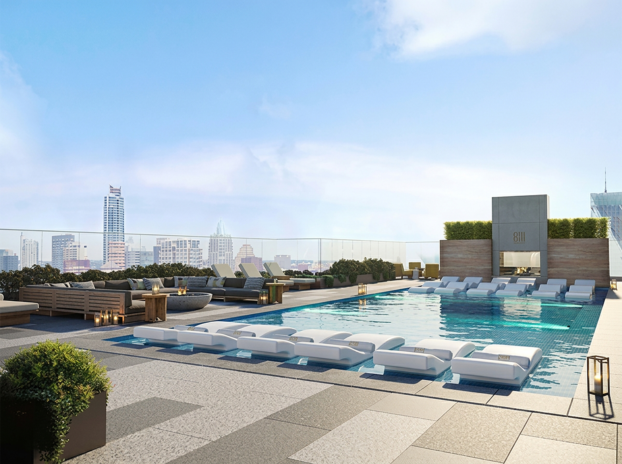 Rooftop infinity pool deck overlooking downtown Austin at sunset